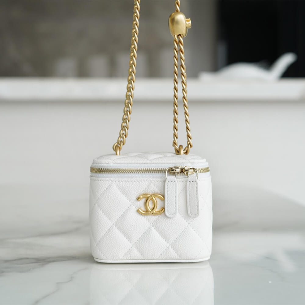 Chanel small gold ball makeup bag 