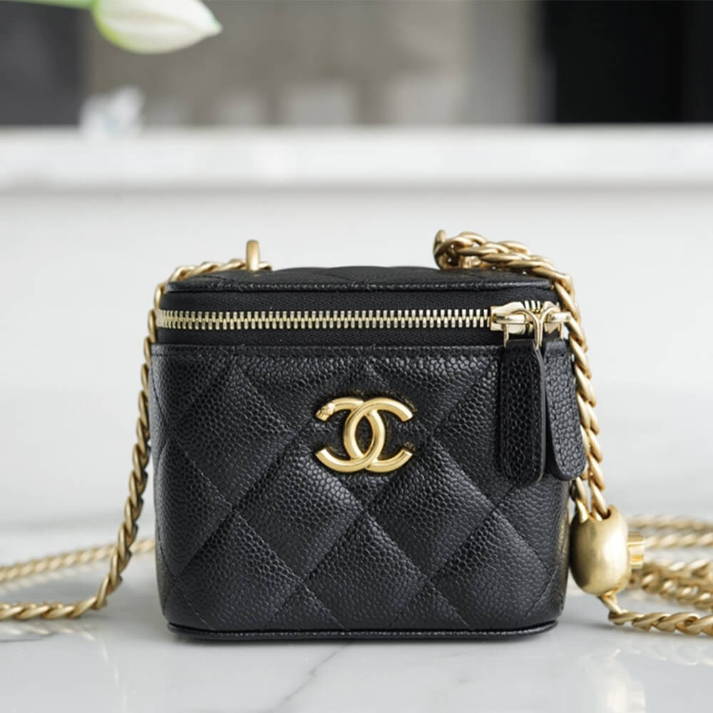 Chanel small gold ball makeup bag 