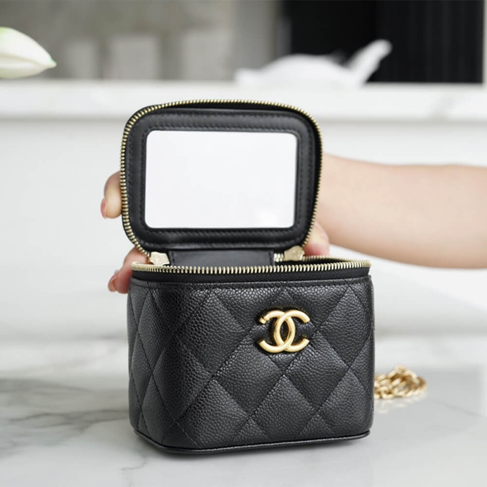 Chanel small gold ball makeup bag 